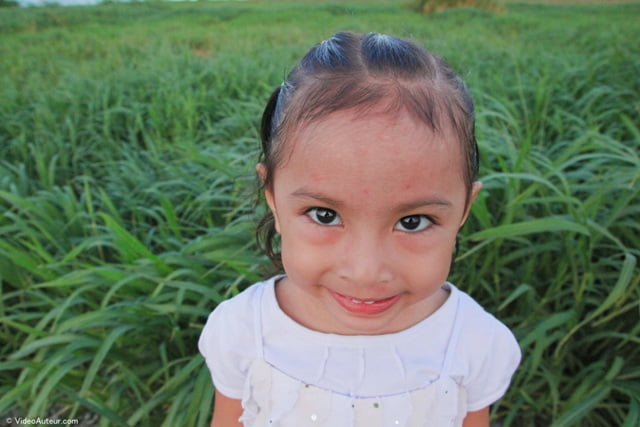 The face of a child photographed at 17 millimeters focal length.