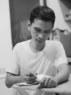 A black and white photograph of me while I'm making notes. A black and white photograph of me while I'm making notes.