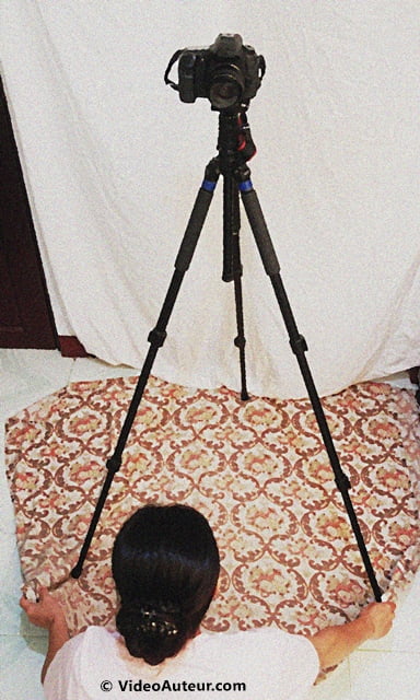 Using tripod and blanket as a slider is a form of DIY camera stabilizer.