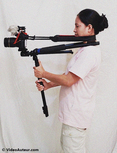 Using the tripod as a shoulder rig - version 2 (side profile view). A form of DIY camera stabilizer.
